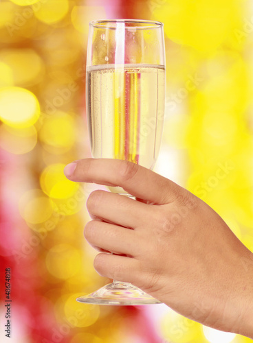 Photo: Beautiful woman drinking champagne at christmas Beautiful woman drinking champagne at christmas
