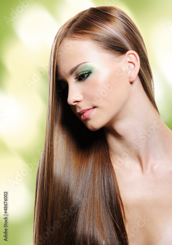 Photo: Portrait of young woman with long straight hair Portrait of young woman with long straight hair