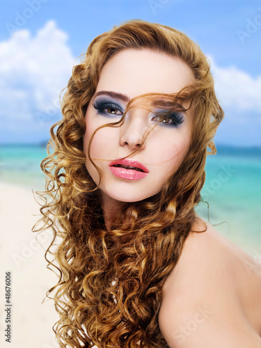 Photo: Beautiful glamour woman with long curly hairs Beautiful glamour woman with long curly hairs