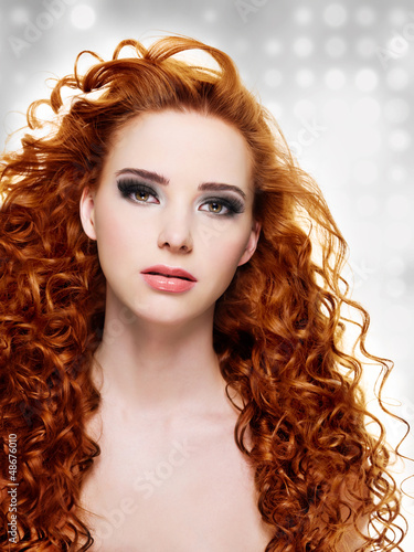 Photo: Beautiful woman with long curly hairs Beautiful woman with long curly hairs