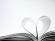 pages of a book curved into a heart shape