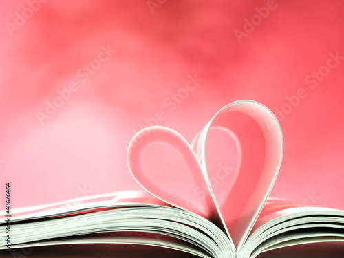 Photo: pages of a book curved into a heart shape pages of a book curved into a heart shape