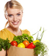 woman holding a shopping bag full of groceries, mango, salad,  r