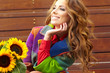 Fashion woman with sunflower at outdoor.