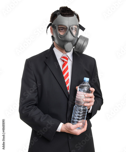Photo: Business man with gas mask holding bottle water, isolated Business man with gas mask holding bottle water, isolated
