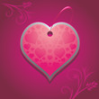 Ornamental heart on the purple background