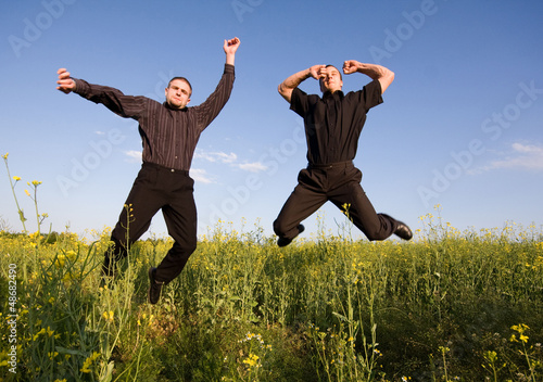 Photo: young businessmans jumping young businessmans jumping