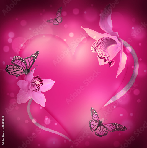 Photo: St. Valentine's Day, heart from orchids and butterflies St. Valentine's Day, heart from orchids and butterflies