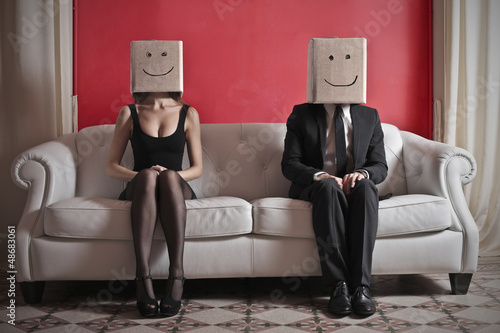 Photo: happy couple on sofa happy couple on sofa