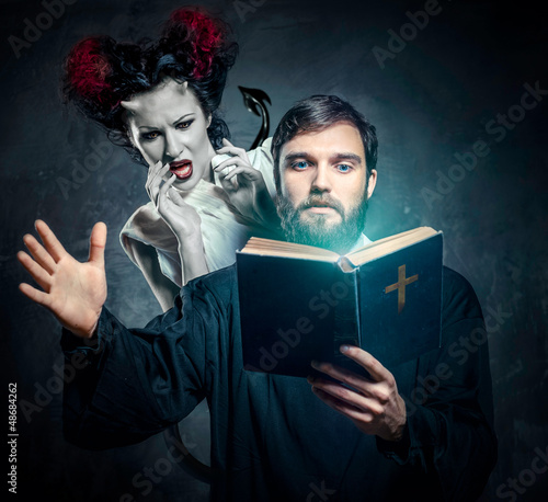 Photo: Priest evicting demons, conceptual photo Priest evicting demons, conceptual photo