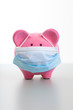 Piggy Bank with Face Mask - Swine Flu Concept