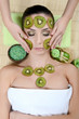 Photo: The girl with a mask from kiwi on the face The girl with a mask from kiwi on the face