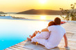 Couple in hug watching sunrise together