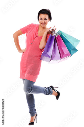 Photo: Young happy woman enjoys shopping Young happy woman enjoys shopping