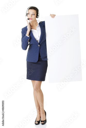 Photo: Call center worker holding blank board Call center worker holding blank board