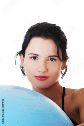 Photo: Beautiful young woman with pilates exercise ball. Beautiful young woman with pilates exercise ball.