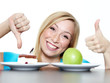 Woman shows thumb up for fruits, thumb down for sweets