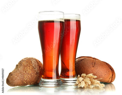 Photo: two glasses of kvass and rye breads with ears, isolated on two glasses of kvass and rye breads with ears, isolated on