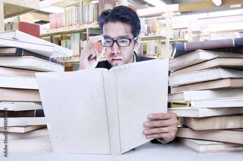 Photo: Busy businessman at library Busy businessman at library