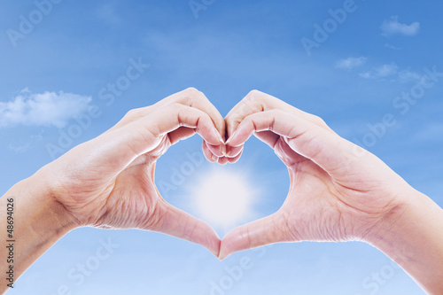 Photo: Hand gesture of love and sun Hand gesture of love and sun