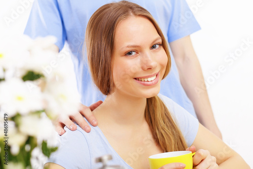 Photo: Beautiful young woman drinking tea Beautiful young woman drinking tea