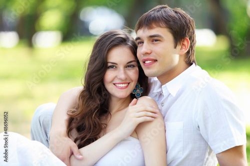 Photo: Young love Couple smiling under blue sky Young love Couple smiling under blue sky
