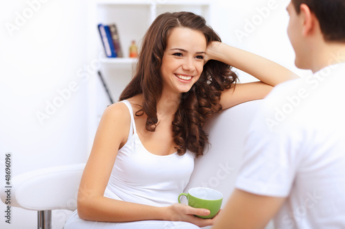 Photo: Young happy couple at hone together s Young happy couple at hone together s