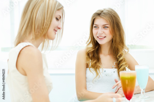 Photo: Young woman with a glass of drink Young woman with a glass of drink