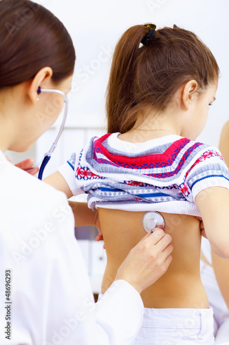 Photo: Little girl and a doctor Little girl and a doctor