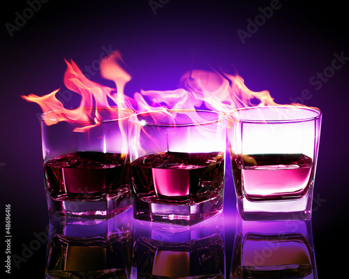 Photo: Three glasses of burning purple absinthe Three glasses of burning purple absinthe