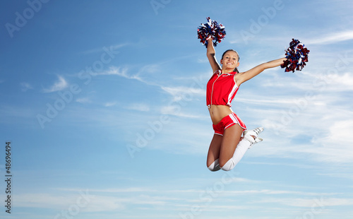 Photo: Young female cheerleader Young female cheerleader