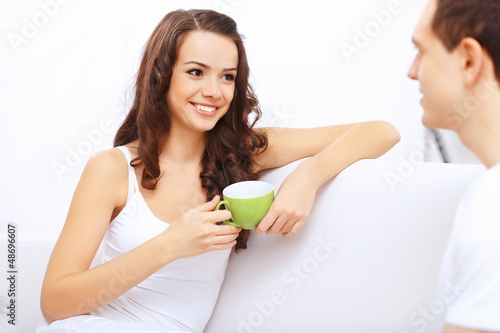 Photo: Young happy couple at hone together s Young happy couple at hone together s