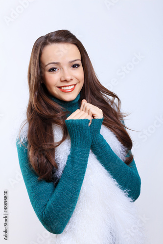 Photo: Young woman wearing warm sweater Young woman wearing warm sweater