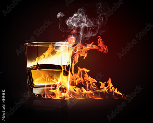 Photo: Glass of burning yellow absinthe Glass of burning yellow absinthe