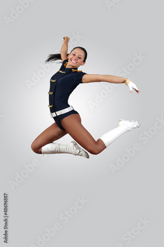 Photo: Young female dancer against white background Young female dancer against white background