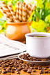 Photo: Coffee cup with fresh coffe beans for breakfast Coffee cup with fresh coffe beans for breakfast