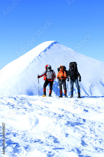 Photo: Winter hiking in snowshoes. Winter hiking in snowshoes.