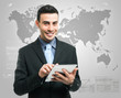 Businessman using his tablet