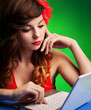 Colorful portrait of  young woman working on a laptop