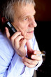 Elderly businessman talking to phone