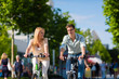 Photo: Couple - man and woman - riding bikes or bicycles Couple - man and woman - riding bikes or bicycles