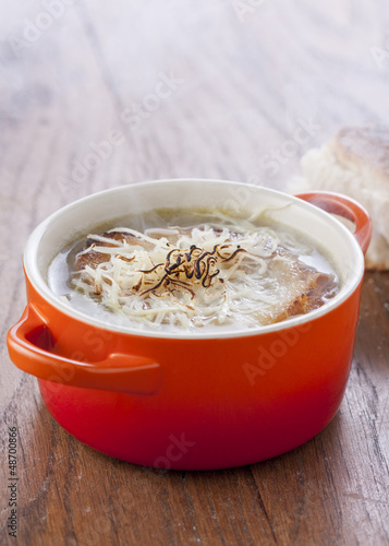 Photo: Onion soup in orange cocotte Onion soup in orange cocotte