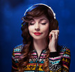 Foto: Girl with headphones enjoying music Girl with headphones enjoying music