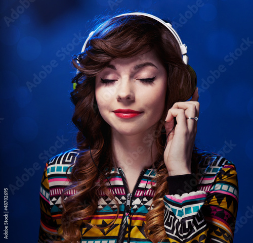 Photo: Girl with headphones enjoying music Girl with headphones enjoying music