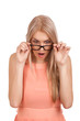 Photo: Surprised blond woman looking down over glasses Surprised blond woman looking down over glasses