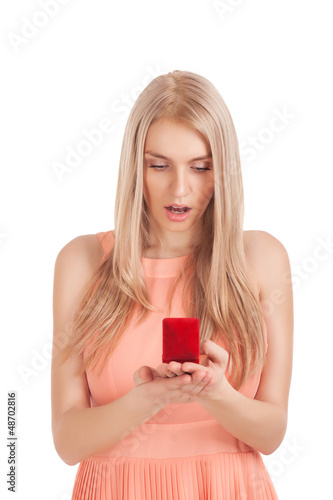 Photo: Surprised blond woman with ring in box Surprised blond woman with ring in box