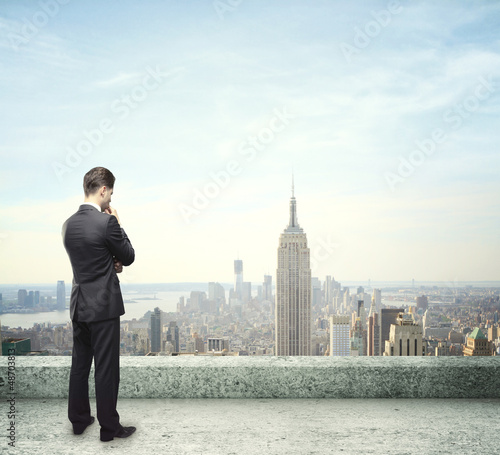 Photo: man looking at city man looking at city