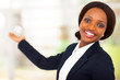 cheerful african american businesswoman presenting