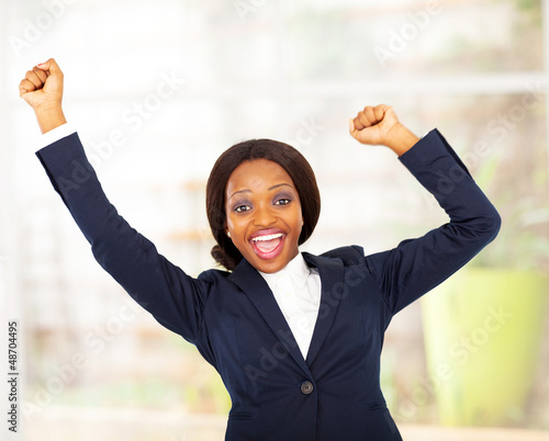 Photo: cheerful african american businesswoman in office cheerful african american businesswoman in office