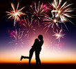 Photo: happy young couple with fireworks background happy young couple with fireworks background